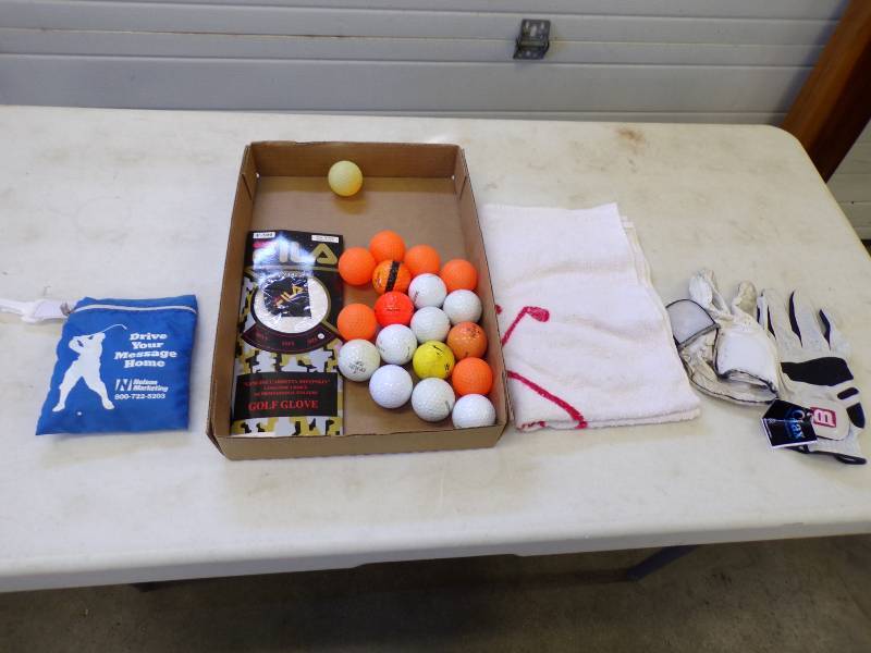 lot 87 image: Golf Balls, Gloves, Towel, and bag of Tees