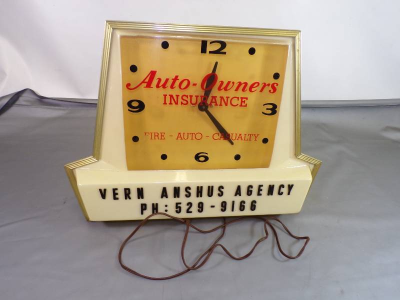 lot 98 image: Vintage Auto Owners Insurance Electric Clock
