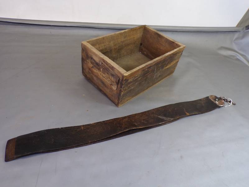 lot 138 image: Wooden box and leather strap