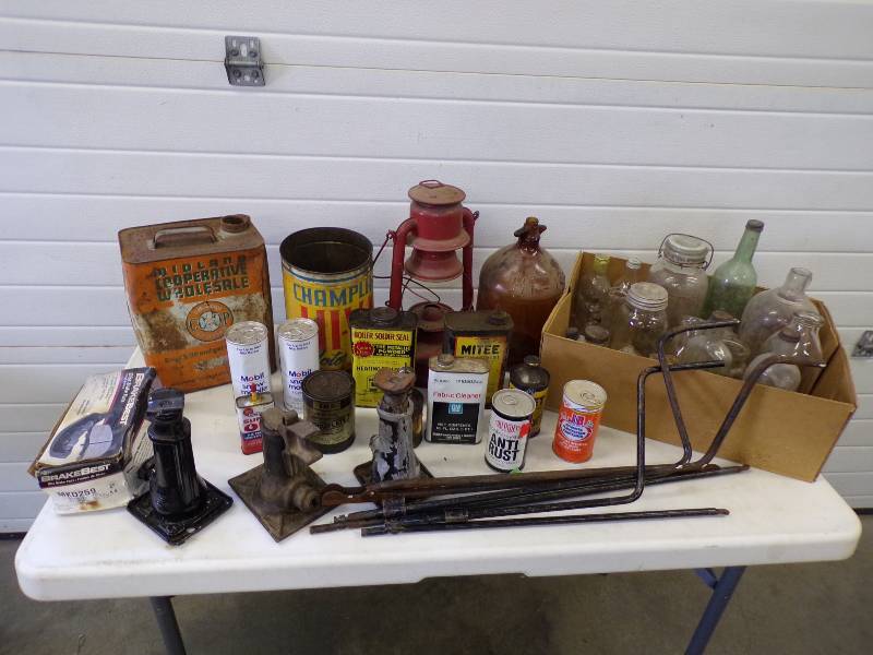 lot 128 image: Vintage Automotive Cans, Tire Jacks, and old bottles