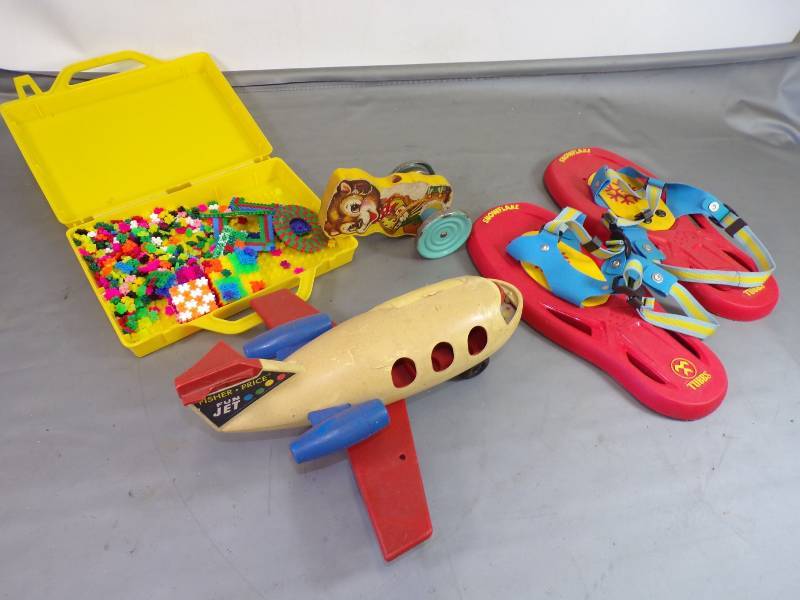 lot 230 image: Vintage Toys, Fisher price  fun jet, snow shoes, building x, and base of walking toy