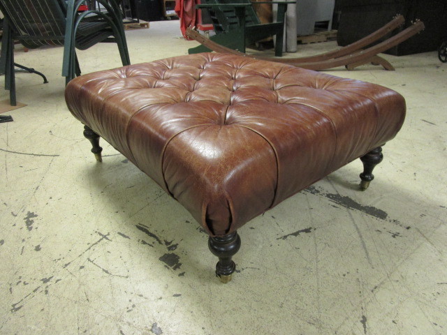lot 609 image: ROLLING LEATHER OTTOMAN