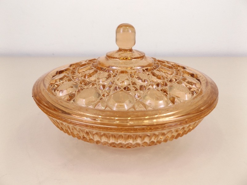 lot 35 image: 7.5 Peach Depression Glass Covered Bowl