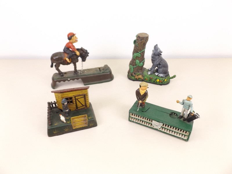 lot 72 image: 4 Vintage Cast Iron Mechanical Coin Banks