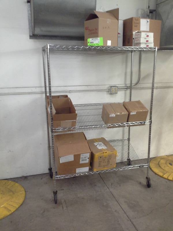 lot 58 image: Uline NSF Rolling Metal Wire Rack Shelving Unit with 2-Sloped Shelves, 2-Flat Shelves