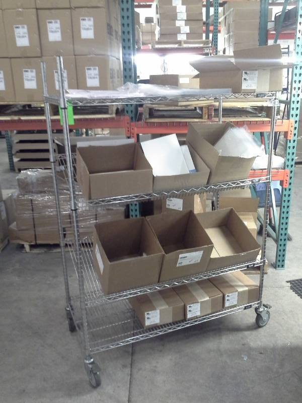 lot 65 image: Uline NSF Rolling Metal Wire Rack Shelving Unit with 2-Sloped Shelves, 2-Flat Shelves