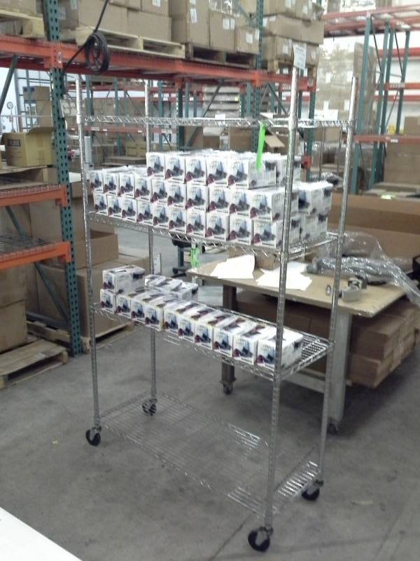 lot 70 image: Uline NSF Rolling Metal Wire Rack Shelving Unit with 4-Shelves