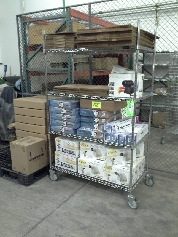 lot 119 image: Uline NSF Rolling Metal Wire Rack Shelving Unit with 4-Shelves
