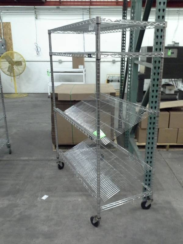 lot 122 image: Uline NSF Rolling Metal Wire Rack Shelving Unit with 2-Sloped Shelves, 2-Flat Shelves