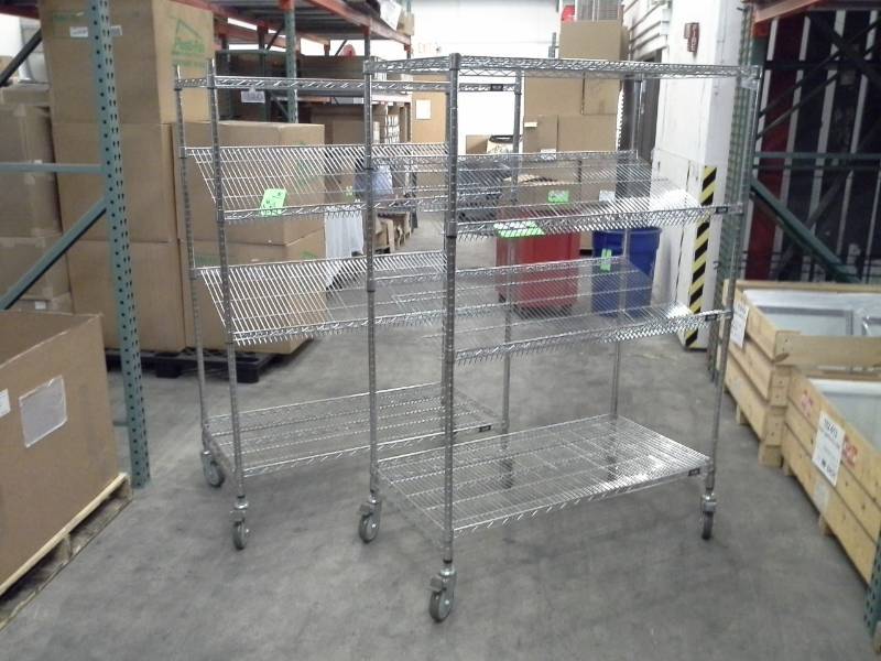 lot 123 image: Lot of (2) Uline NSF Rolling Metal Wire Rack Shelving Unit with 2-Sloped Shelves, 2-Flat Shelves
