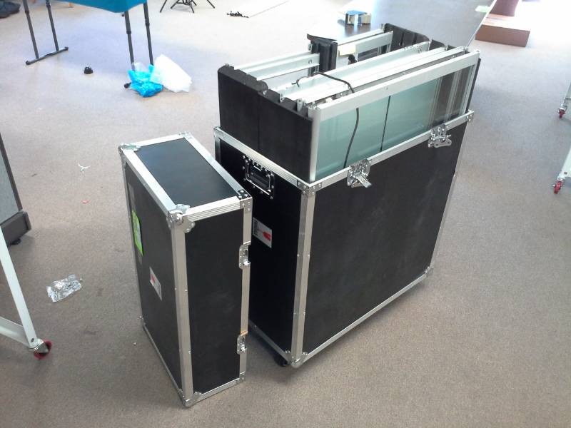 lot 1128 image: Lighted Glass Trade Show Cabinet with Rolling Road Case