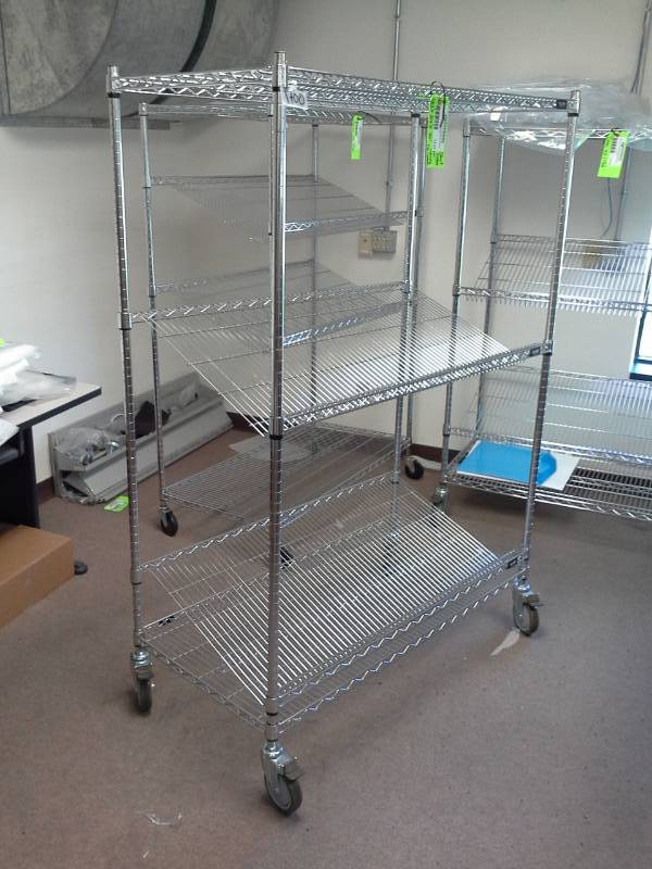 lot 1132 image: Uline NSF Rolling Metal Wire Rack Shelving Unit with 2-Sloped Shelves, 2-Flat Shelves