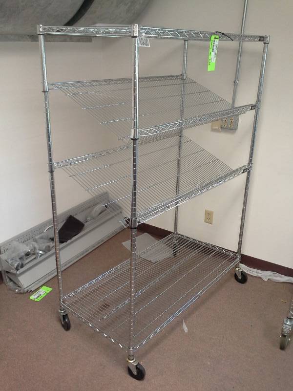 lot 1134 image: Uline NSF Rolling Metal Wire Rack Shelving Unit with 2-Sloped Shelves, 2-Flat Shelves