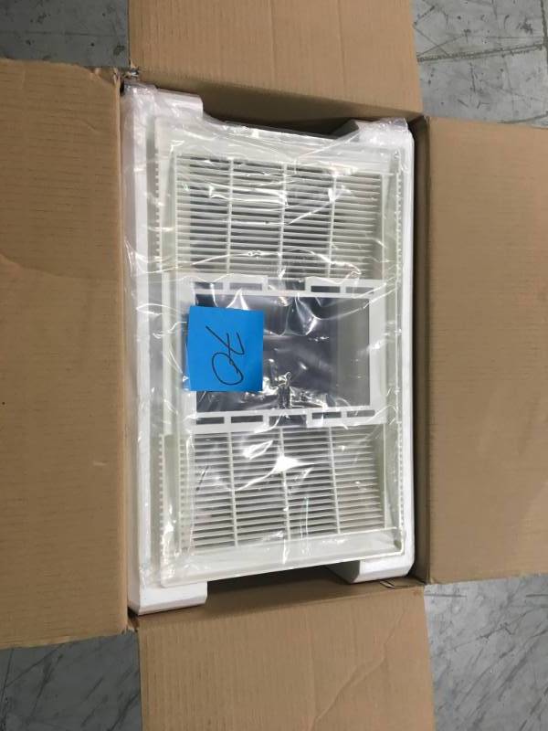 lot 70 image: NuTone 70 CFM Ceiling Bathroom Exhaust Fan with Light and 1300-Watt Heater  in good condition