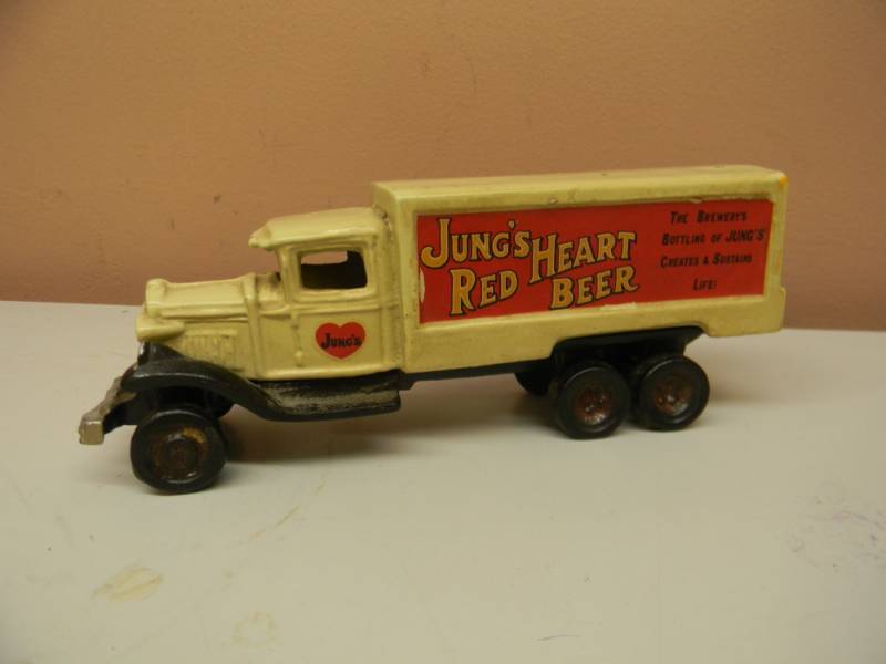 lot 41 image: VERY RARE VINTAGE JUNGS RED HEART BEER CAST DELIVERY TRUCK - THE BREWERYS BOTTLING OF JUNGS CREATES & SUSTAINS LIFE - APPROX 8 BY 3 - SEE PICTURES