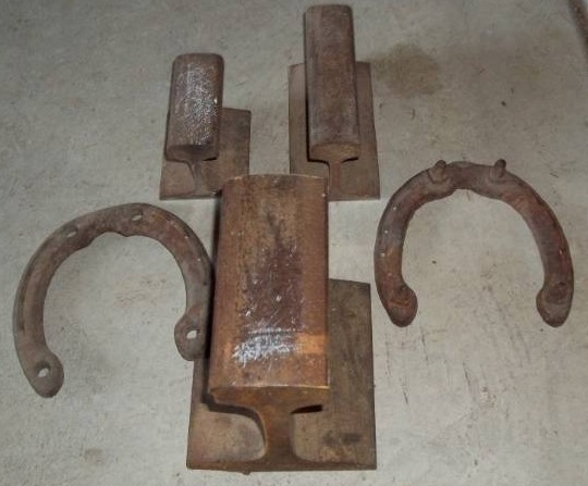 lot 65 image: Train Rail Pieces and Horse Shoes