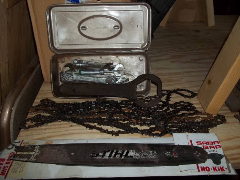 lot 66 image: Wrenches and Chainsaw Chains