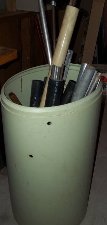 lot 90 image: Barrel of Metal Pipes and More
