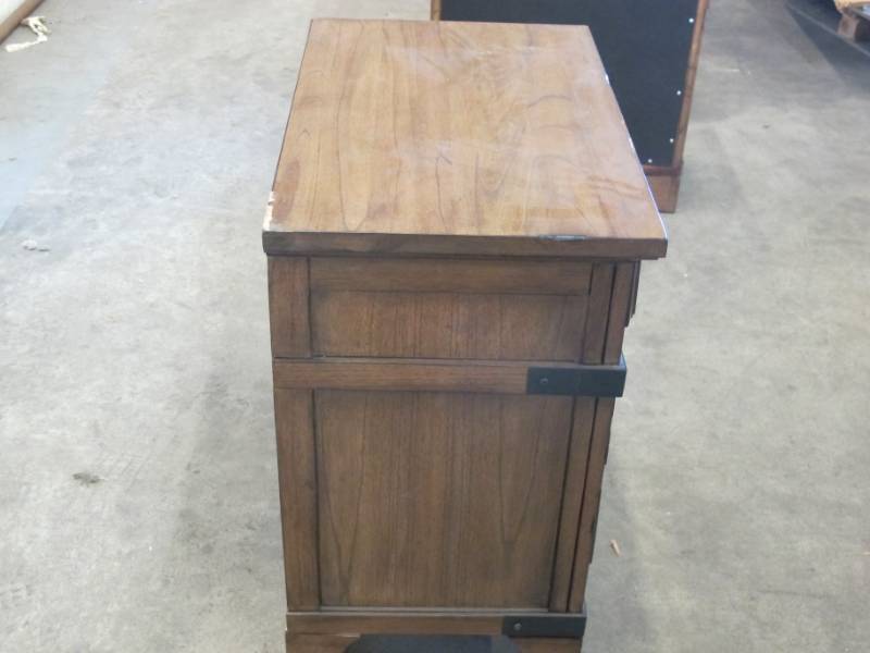 lot 29 image: Lifestyle Solutions Boston 3 Drawer Nightstand in Vintage Brown - Broken leg  Used