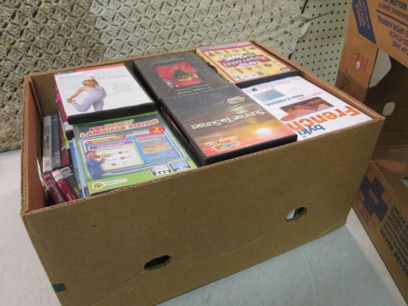 lot 24 image: Box Full of DVDs and Games C-3...
