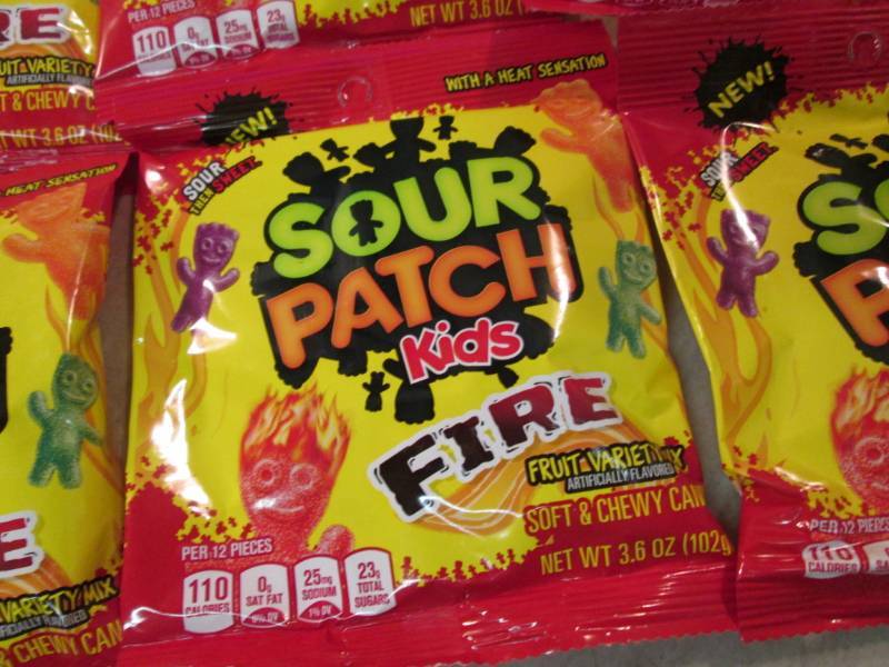 lot 52 image: 12 Bags of Sour Patch Kids Fire Bes...