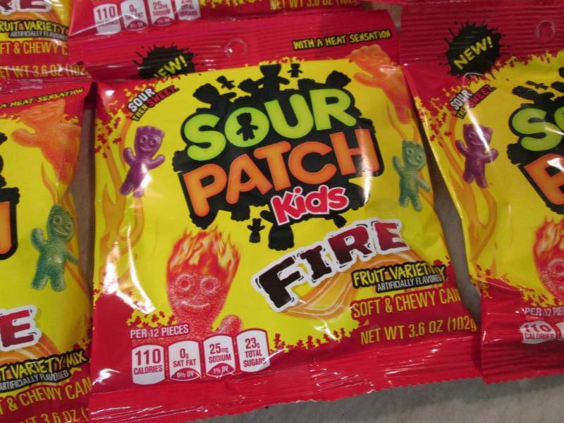 lot 54 image: 12 Bags of Sour Patch Kids Fire Bes...