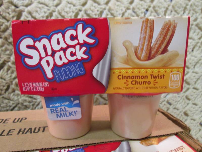 lot 62 image: Case of 12 4-Pack Cups of Cinnamon ...