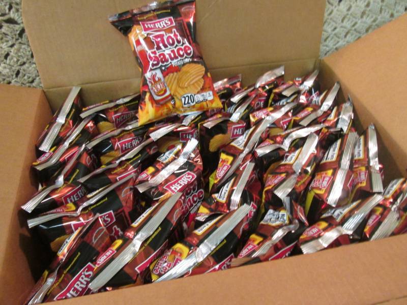lot 157 image: Case of 30 Bags of Herrs Hot Sauce...