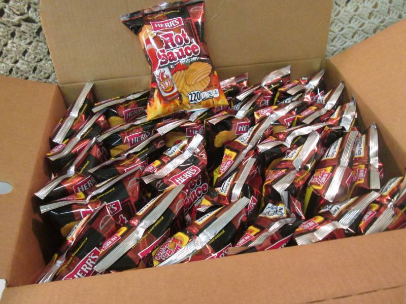 lot 159 image: Case of 30 Bags of Herrs Hot Sauce...
