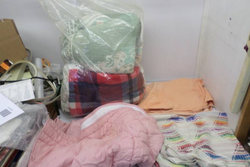 lot 84 image: Bag Full of Towels, Blankets and other Cloth Material