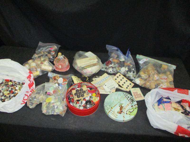 lot 122 image: Empty Spools, Old Buttons, Old Pin Holderm Thimbles and more