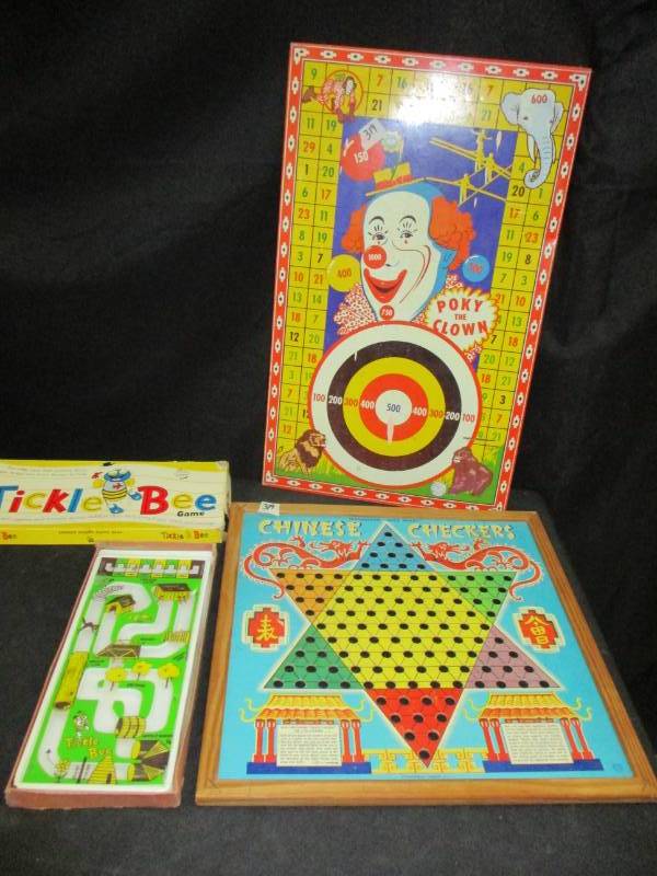lot 123 image: Antique Metal Poky The Clown Gamne Board, and a couple other Old games