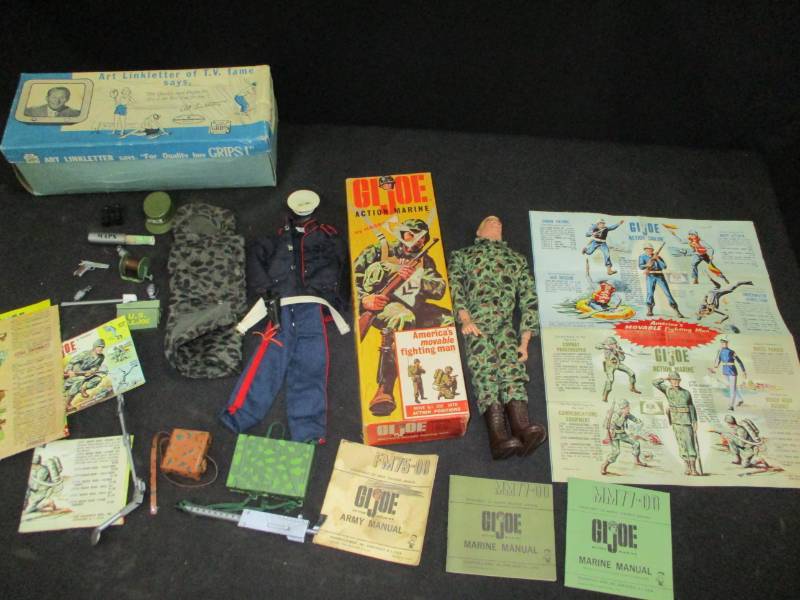 lot 124 image: G.I.Joe in mint condition in box and lots of manuuals, booklets, instruction and weapond, granades, wire, caps, uniforms, sleeping bag and more