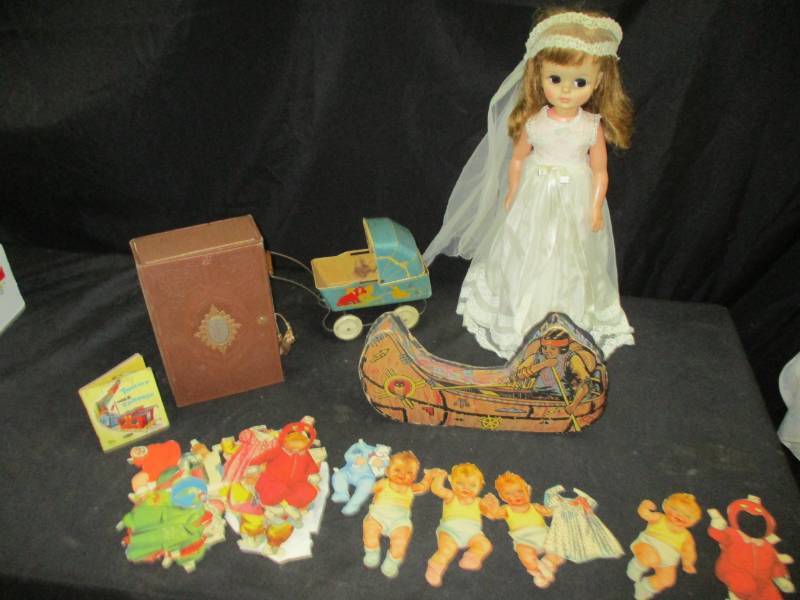 lot 125 image: Old Doll, Metal Baby Carriage, Paper Dolls baby ones old box and Canoe Box