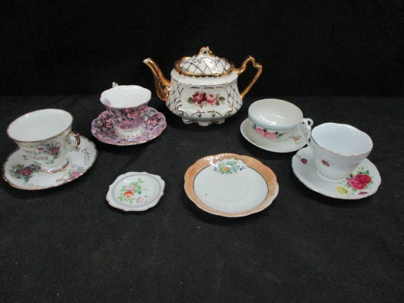 lot 132 image: Tea Pot and a few Cups with Saucers