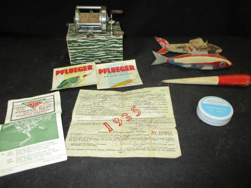lot 144 image: Antique Fishing Items, Pflueger Reel in Box, Decoys, and 1935 Fishing Licence