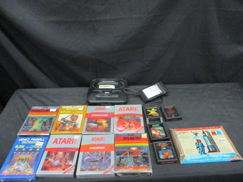 lot 25 image: Genesis Box no chords, 7 new Unopened Artari Games, a few other Atari games and Vido pinball, Riddle of the Sphinx, WarLords and more