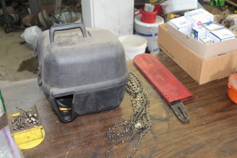 lot 218 image: Chainsaw Chains, Blades, Covers, Empty Case