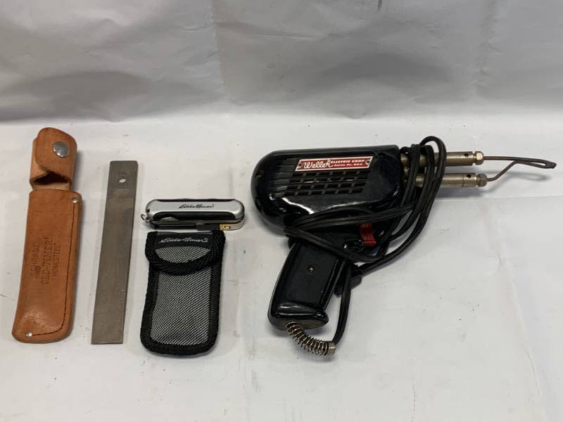 lot 11 image: Schrade Stone, Eddie Bauer Multi Tool, Weller Soldering Gun