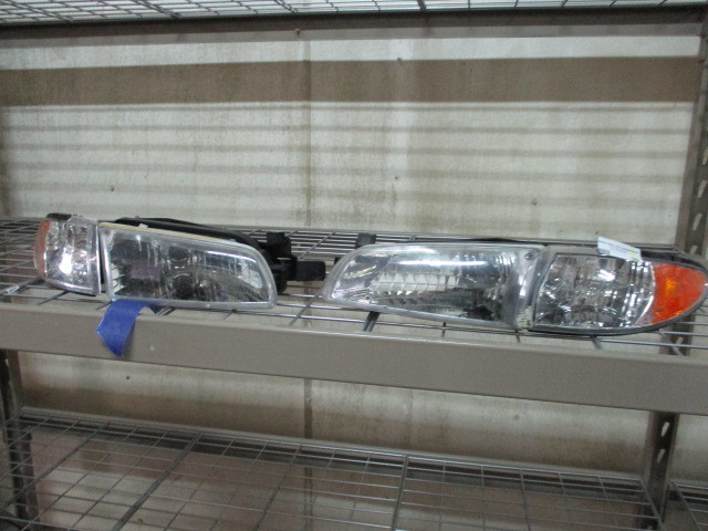 lot 29 image: 2001 Grand Prix Headlamps