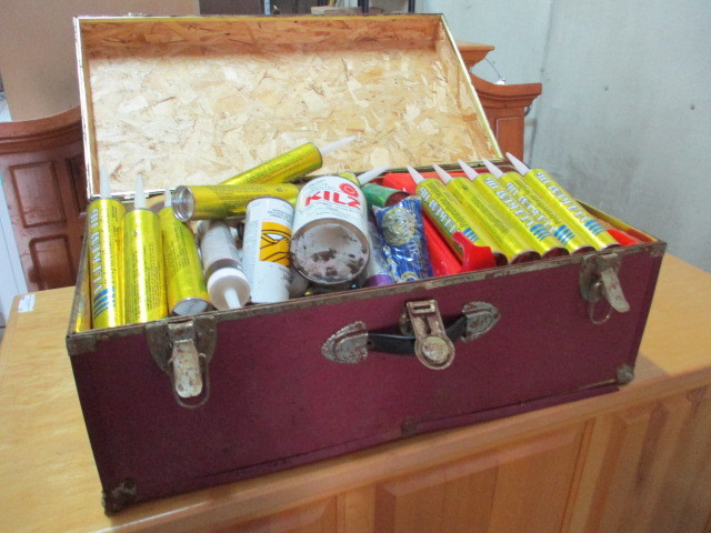 lot 56 image: Caulk and construction supplies