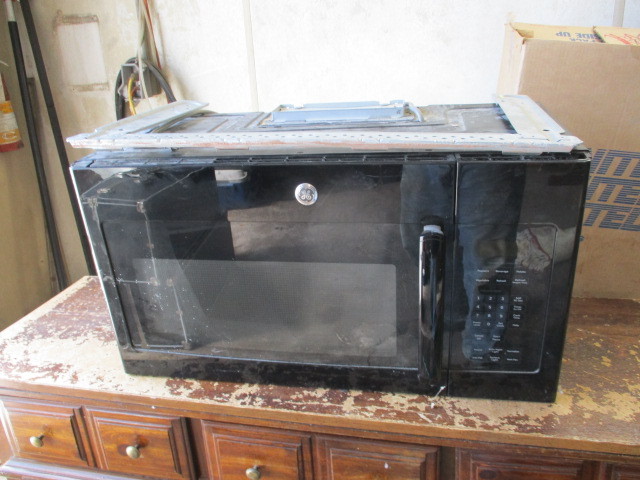 lot 67 image: GE Undermount microwave