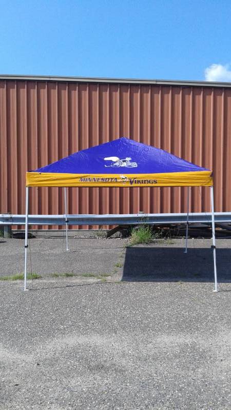 lot 2 image: Minnesota Viking 10 x 10 Pop Up Canopy, Good Working Condition, Only Been Used A Couple Times, Travel Bag Shows Some Wear