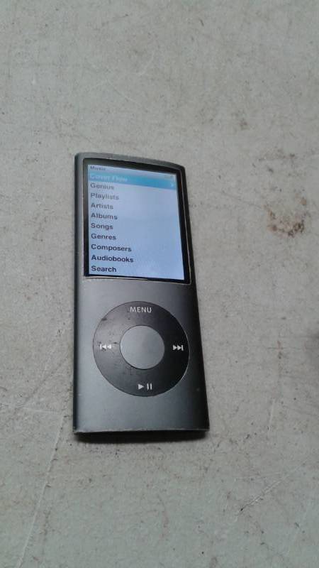 lot 48 image: Apple Music Ipod 16gb, Has Two Cords, Works Good