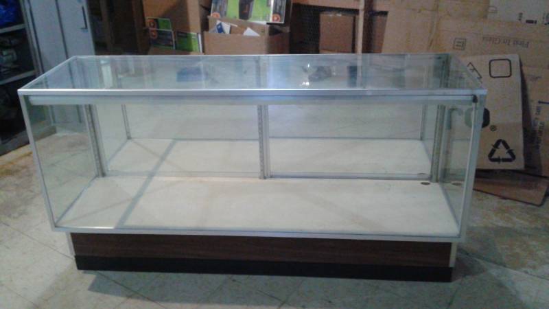 lot 70 image: Glass Store Display Cabinet, Used, Some Wear, No Shelves Or Brackets, Has Sliding Back Doors, 70 x 20 x 39