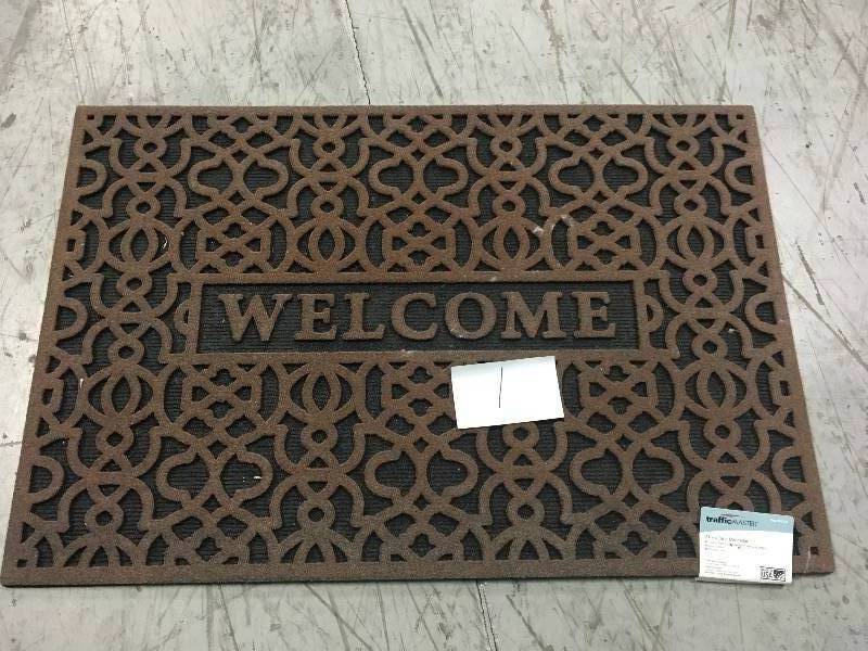 lot 1 image: TrafficMASTER Geo Welcome Brown 24 in. x 36 in. Door Mat in good condition