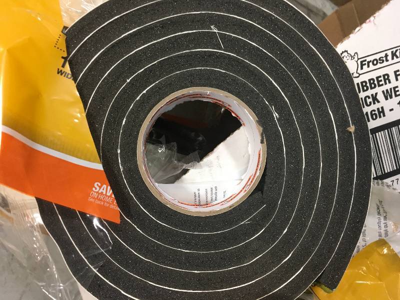 lot 42 image: Frost King EO 1-14 in. x 716 in. x 10 ft. Black High-Density Rubber Foam Weatherstrip Tape not used