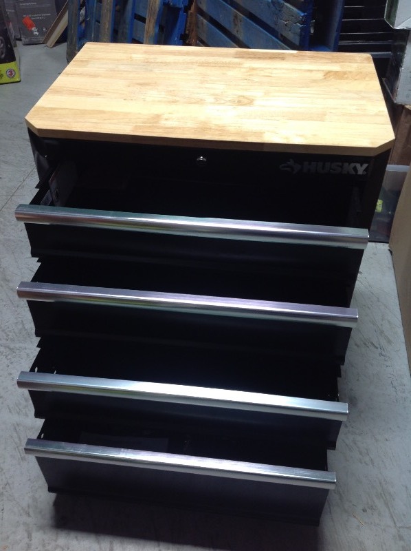 lot 112 image: Husky 30 in. H x 28 in. W x 18 in. D 4-Drawer Welded Base Cabinet in Black not used whit small damage on the side back