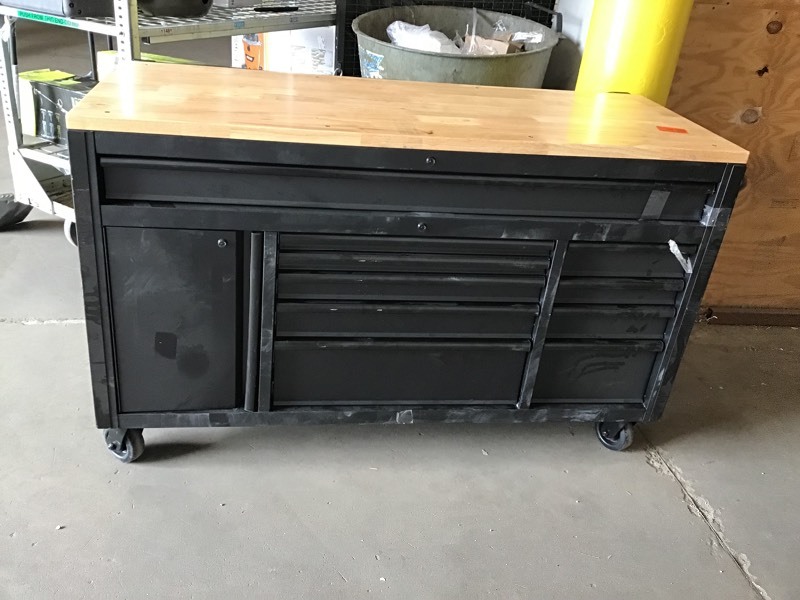 lot 115 image: Husky 61 in. 10-Drawer 1-Door 24 in. D Mobile Workbench with Solid Wood Top, Pegboard and Shelf in Textured Black Matte whit damage please review the photos