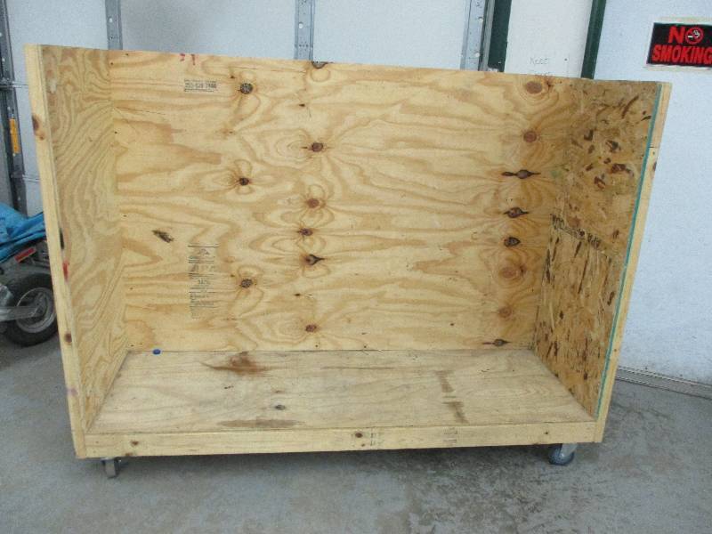 lot 29 image: LARGE Heavy Duty Homemade  Cart with Large Casters (you can put shelves in them to but I filled with boxes to move stuff from storage to floor)